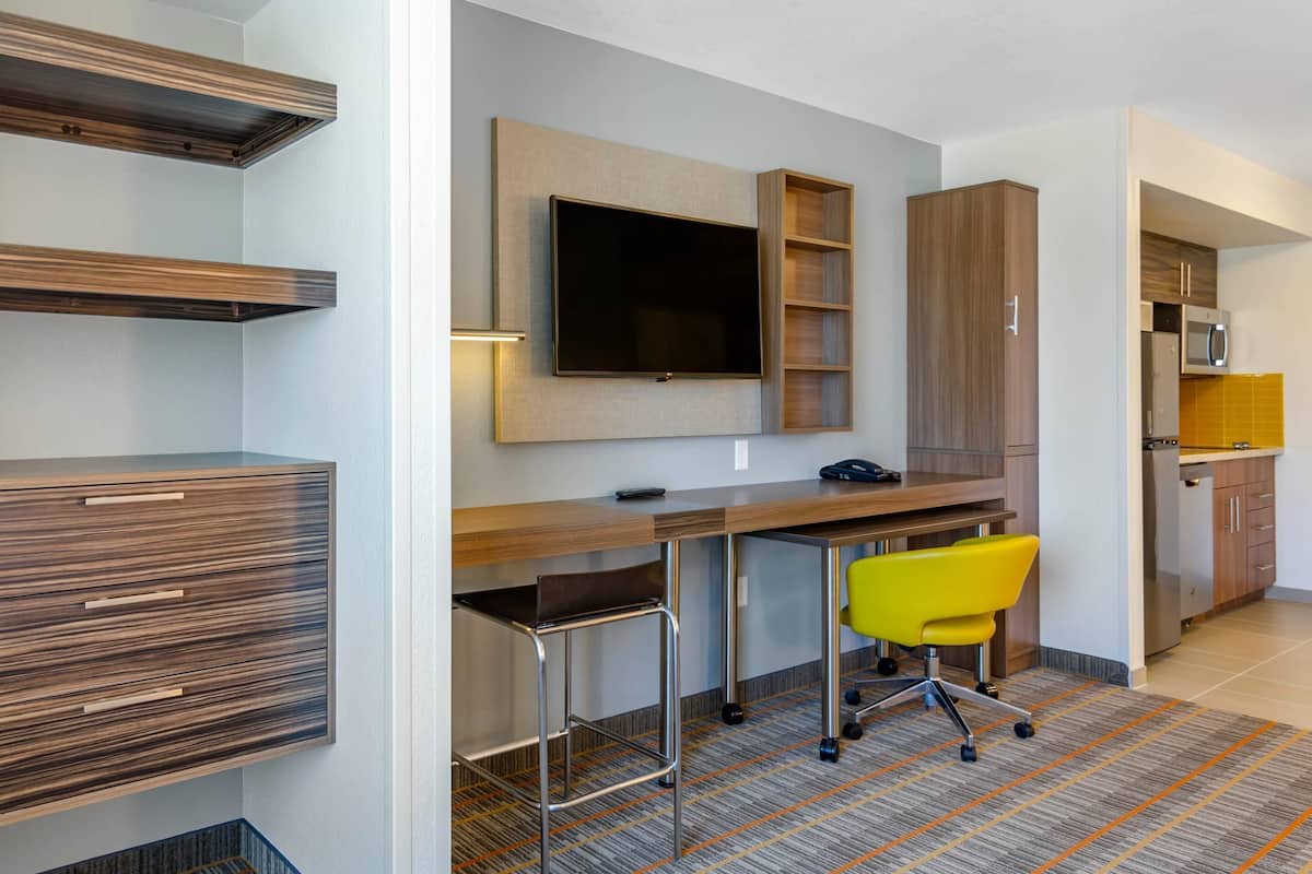 Desk, laptop workspace, blackout drapes, iron/ironing board