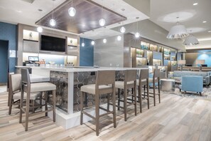 A modern kitchen with a central island, bar stools, and pendant lighting. - Residence Inn by Marriott San Jose North/Silicon Valley (San Jose)