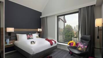 Premium bedding, desk, laptop workspace, blackout drapes