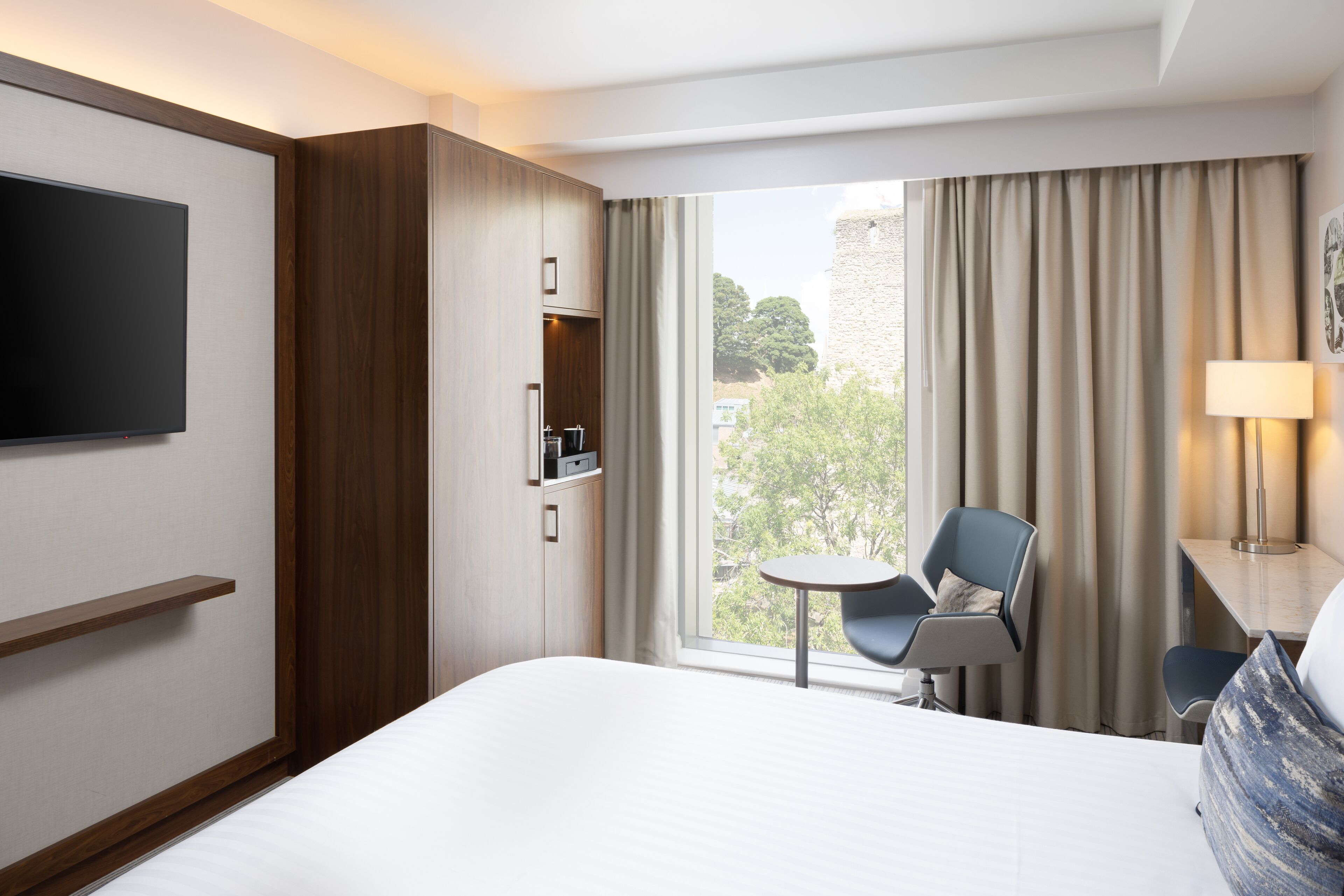 premium room, 1 king bed, non smoking (view) | pillow-top beds, in-room safe, desk, laptop workspace