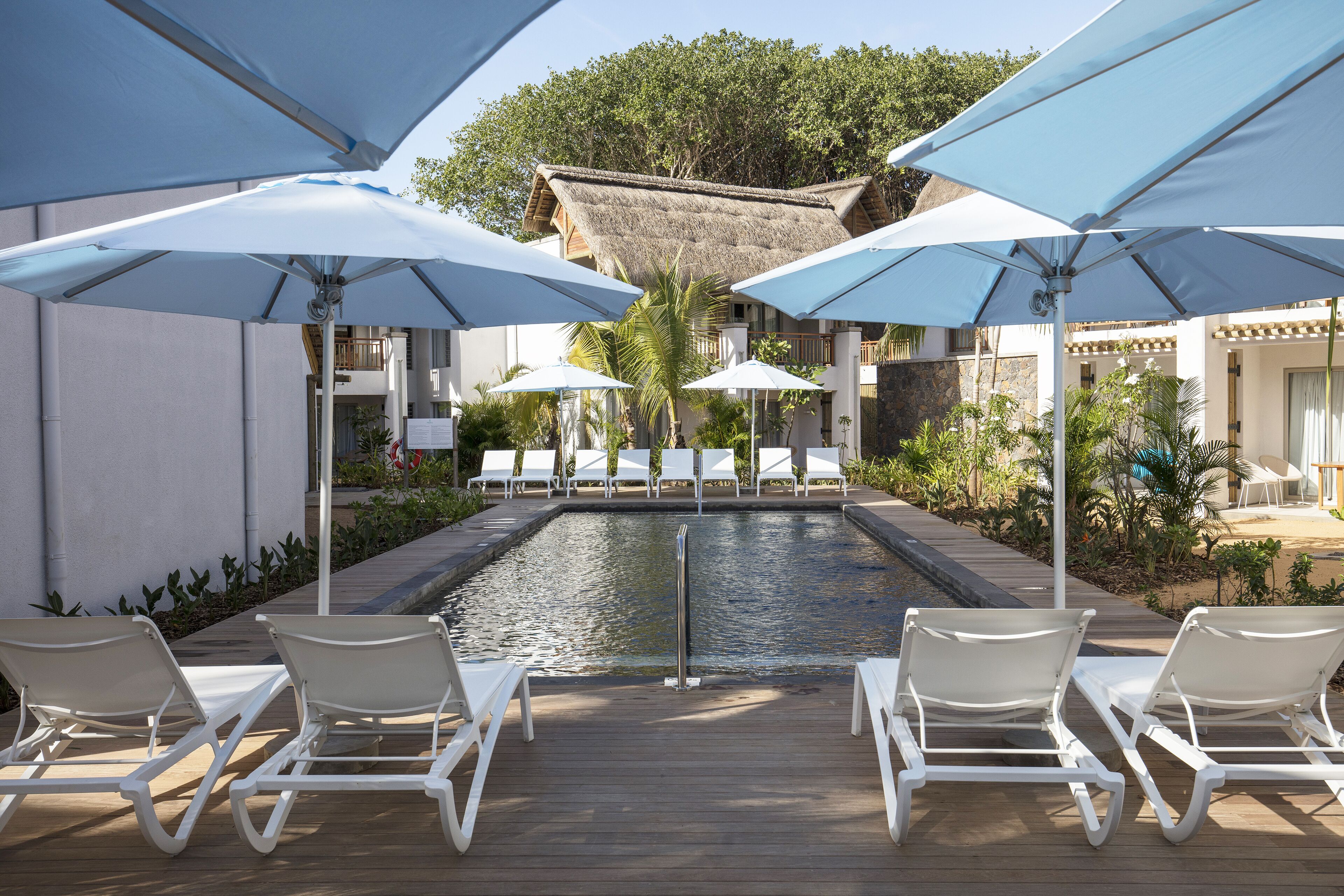 outdoor pool, pool umbrellas, pool loungers