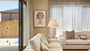 Deluxe House, 4 Bedrooms, Pool View | Living area | Flat-screen TV