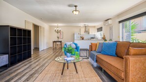 Deluxe House, Lake View | Living area | Flat-screen TV - Private Coastal Escape Stunning Views (Runaway Bay)