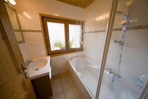 Bathtub, hair dryer, towels