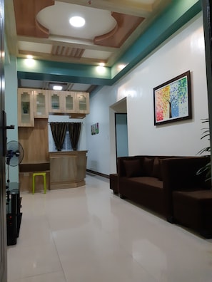 Deluxe Apartment | Living area | Flat-screen TV - Zya Guest Home apartments (Baguio)