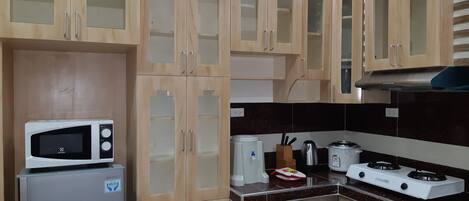 Standard Apartment | Private kitchen | Full-size fridge, microwave, stovetop, rice cooker