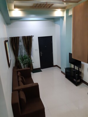 Deluxe Apartment | Living room | Flat-screen TV - Zya Guest Home apartments (Baguio)