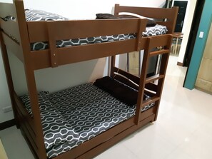A bunk bed with a geometric patterned mattress. - Zya Guest Home apartments (Baguio)