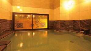 A spa pool with a glass door, tiled walls, and a marble design. - AB Hotel Tokai Otagawa (Tokai)