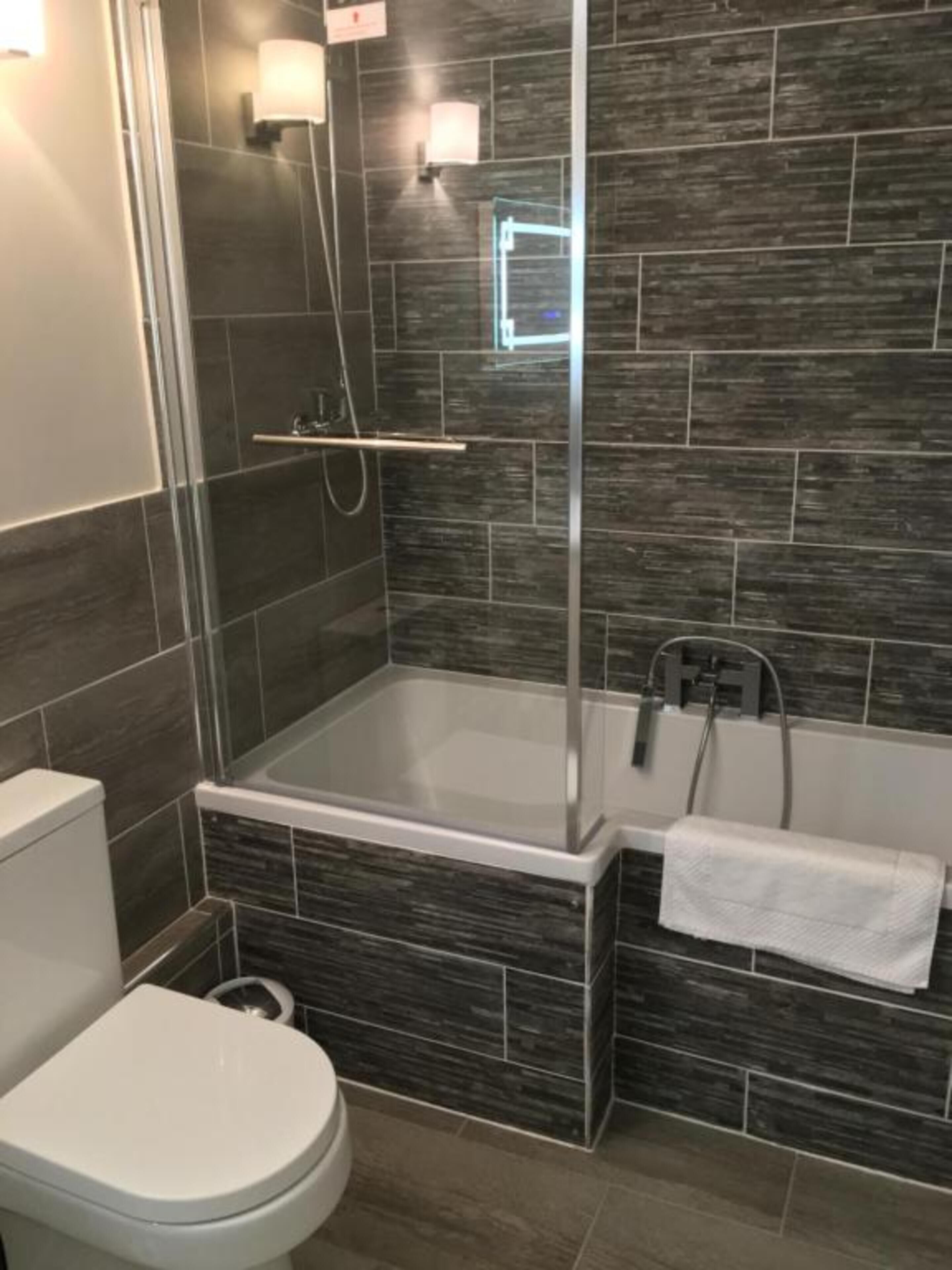 standard room, 1 king bed | bathroom | shower, designer toiletries, hair dryer, dressing gowns