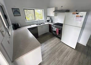 Fridge, microwave, oven, stovetop - Ohana Hawaiian term meaning "family" (Agnes Water)
