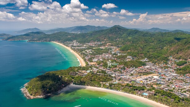 An aerial view of a coastal town with a beach, named Karon Beach, and a hotel named Karon Kata. - KK - Karon Kata Boutique Hotel (Karon)