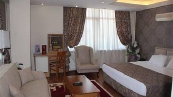 Deluxe Room | 1 bedroom, in-room safe, desk, free WiFi