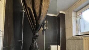 Basic Double Room Single Use, 1 Queen Bed, Non Smoking | Bathroom | Shower, hair dryer, towels, soap