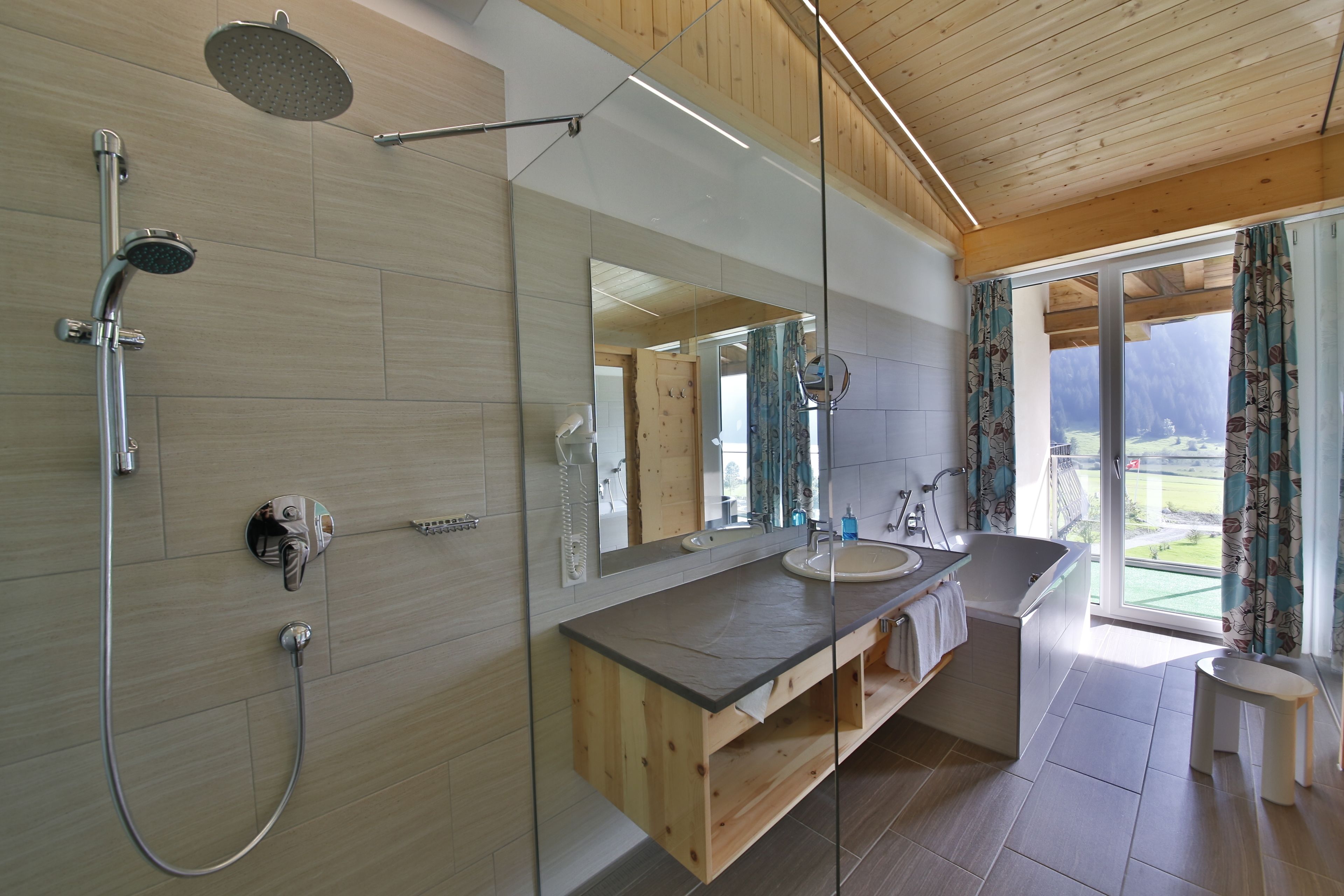 junior suite, lake view | bathroom | bathrobes, towels