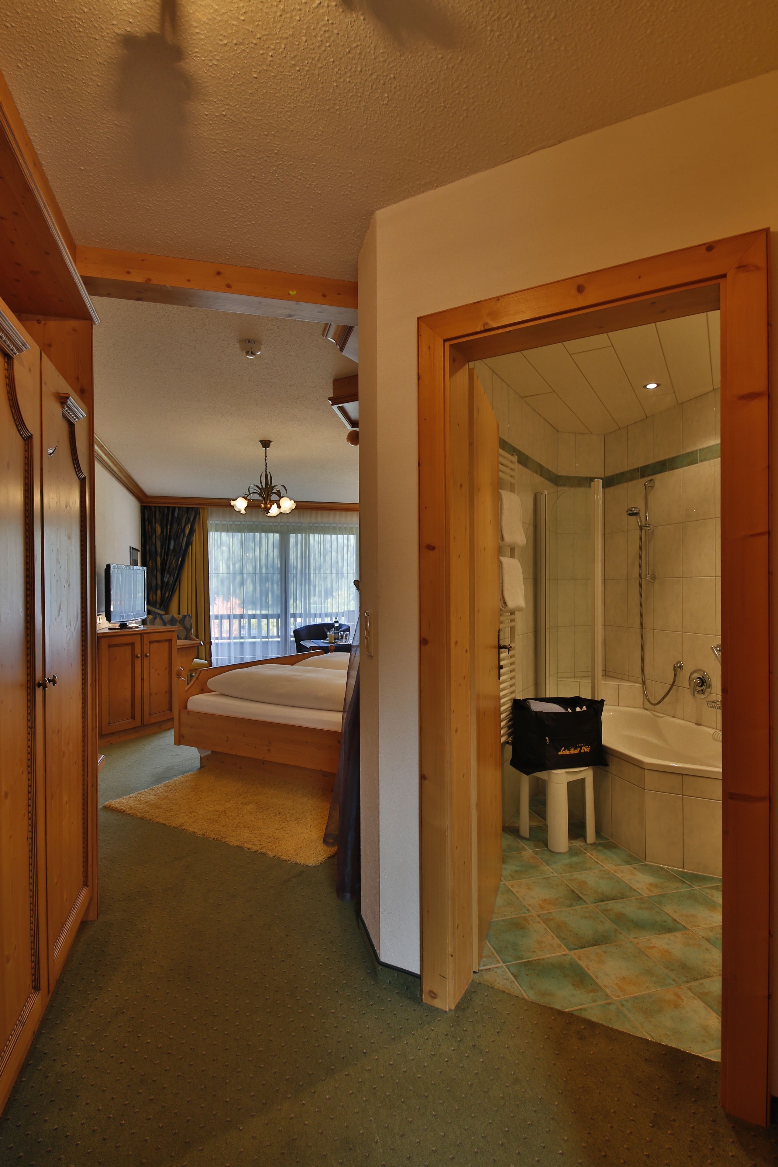 comfort double room, lake view | minibar, desk, laptop workspace, cots/infant beds