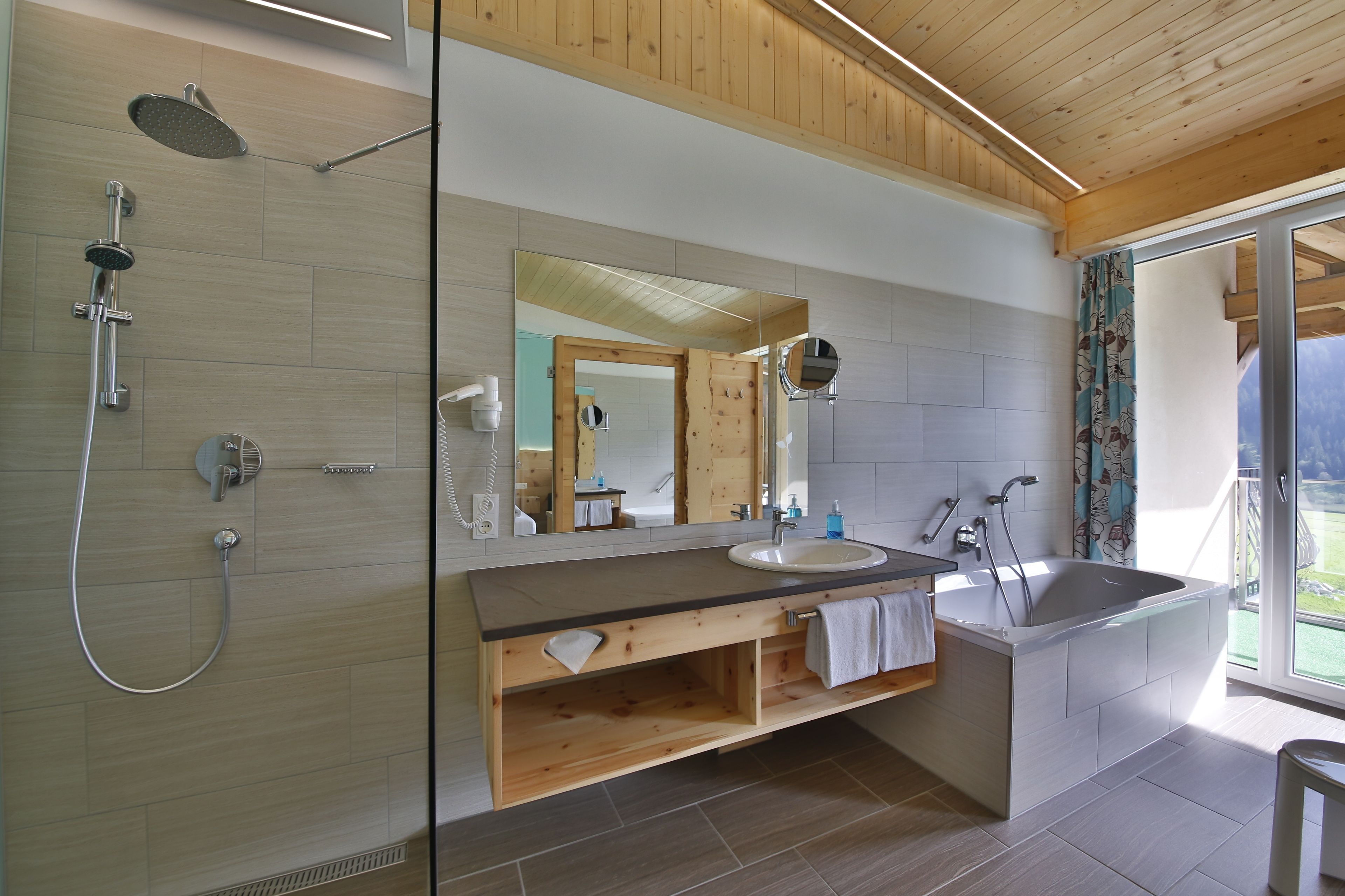 junior suite, lake view | bathroom | bathrobes, towels