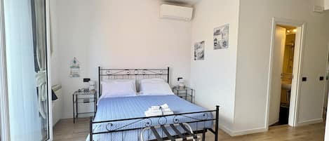 Triple Room, Balcony | In-room safe, desk, free WiFi, bed sheets