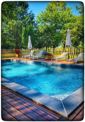 Outdoor pool, a heated pool, pool loungers