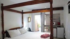 Suite de lujo, 1 cama Queen size | Área de sala de estar | Televisión de pantalla plana 