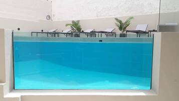 Outdoor pool, open 10:30 AM to 6:30 PM, pool umbrellas, sun loungers
