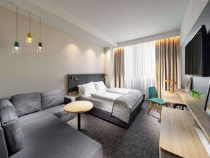 Executive Room with Sofa | Premium bedding, desk, laptop workspace, blackout drapes