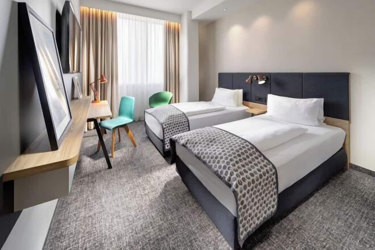 Premium bedding, desk, laptop workspace, blackout curtains