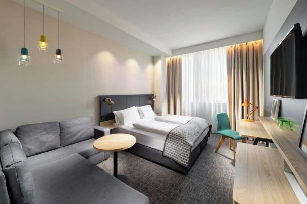 Premium bedding, desk, laptop workspace, blackout curtains
