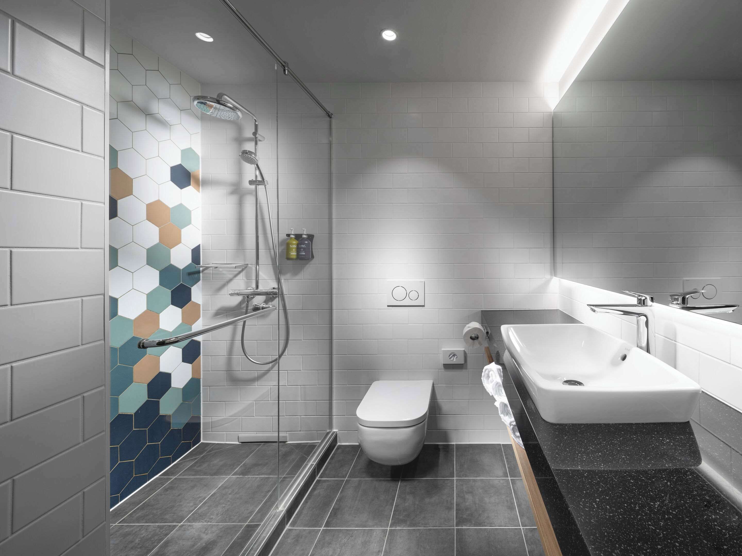 shower, rainfall showerhead, hair dryer, towels