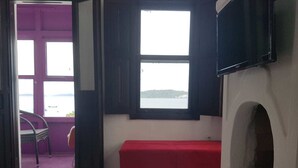 Comfort Room, Multiple Beds, Sea View | Living area | LCD TV, fireplace - reds pansiyon (Bodrum)