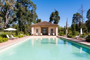 Seasonal outdoor pool, open 9:00 AM to 7:30 PM, pool umbrellas