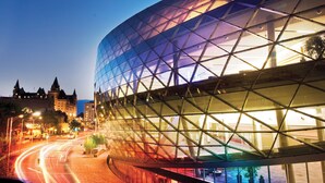 A modern building with a glass facade and a geometric design. - Holiday Inn Express & Suites Downtown Ottawa East by IHG (Ottawa)