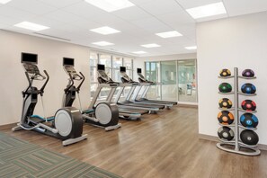 A gym with treadmills, elliptical machines, and a rack of medicine balls. - Holiday Inn Express & Suites Downtown Ottawa East by IHG (Ottawa)