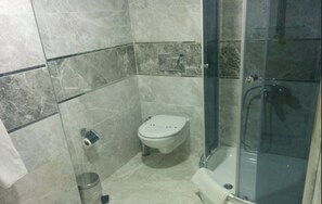 Shower, free toiletries, hair dryer, slippers