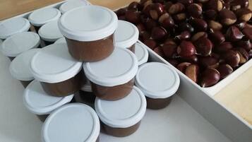 A collection of jars with lids and chestnuts.