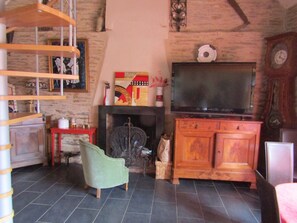 TV, fireplace, books, offices