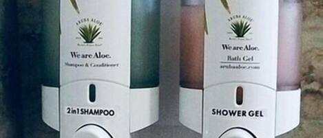 Two bottles of WeareAloe shampoo and shower gel.