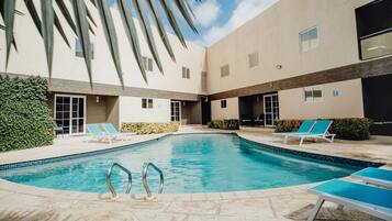 Outdoor pool, open 8:00 AM to 9:00 PM, pool umbrellas, sun loungers