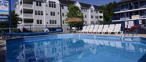 Seasonal outdoor pool, open 9:00 AM to 8:00 PM, pool umbrellas