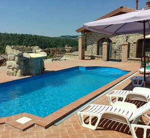 Outdoor pool, open 9:00 AM to 7:00 PM, pool umbrellas, pool loungers