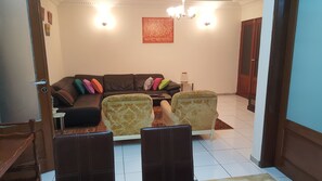 Apartment, 2 Bedrooms | Living area | 32-inch flat-screen TV with satellite channels, TV - Home's Heart (Yaoundé)