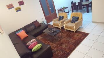 Apartment, 2 Bedrooms | Living area | 32-inch flat-screen TV with satellite channels, TV