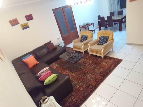 Apartment, 2 Bedrooms | Living area | 32-inch flat-screen TV with satellite channels, TV - Home's Heart (Yaoundé)