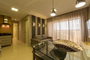 Comfort Apartment, 2 Queen Beds, Beach View | Living area | TV, fireplace - Hotel Home Vacations (Natal)