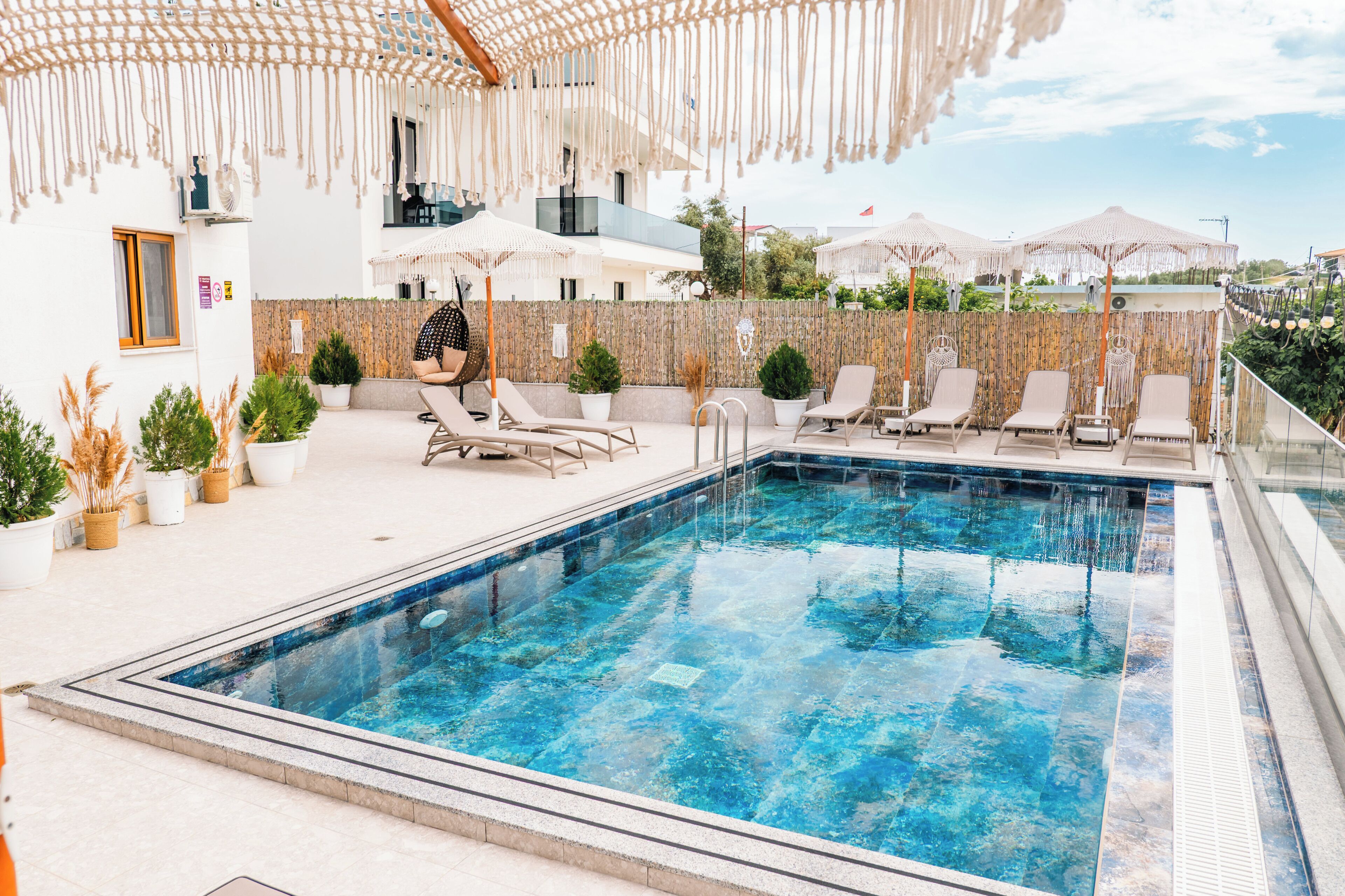 Seasonal outdoor pool, pool umbrellas, pool loungers