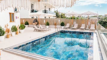 Seasonal outdoor pool, pool umbrellas, pool loungers