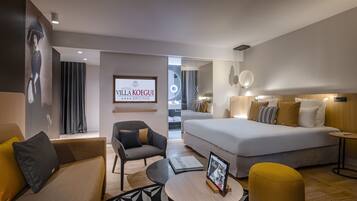 Junior Suite | Living area | 20-inch LCD TV with satellite channels, TV