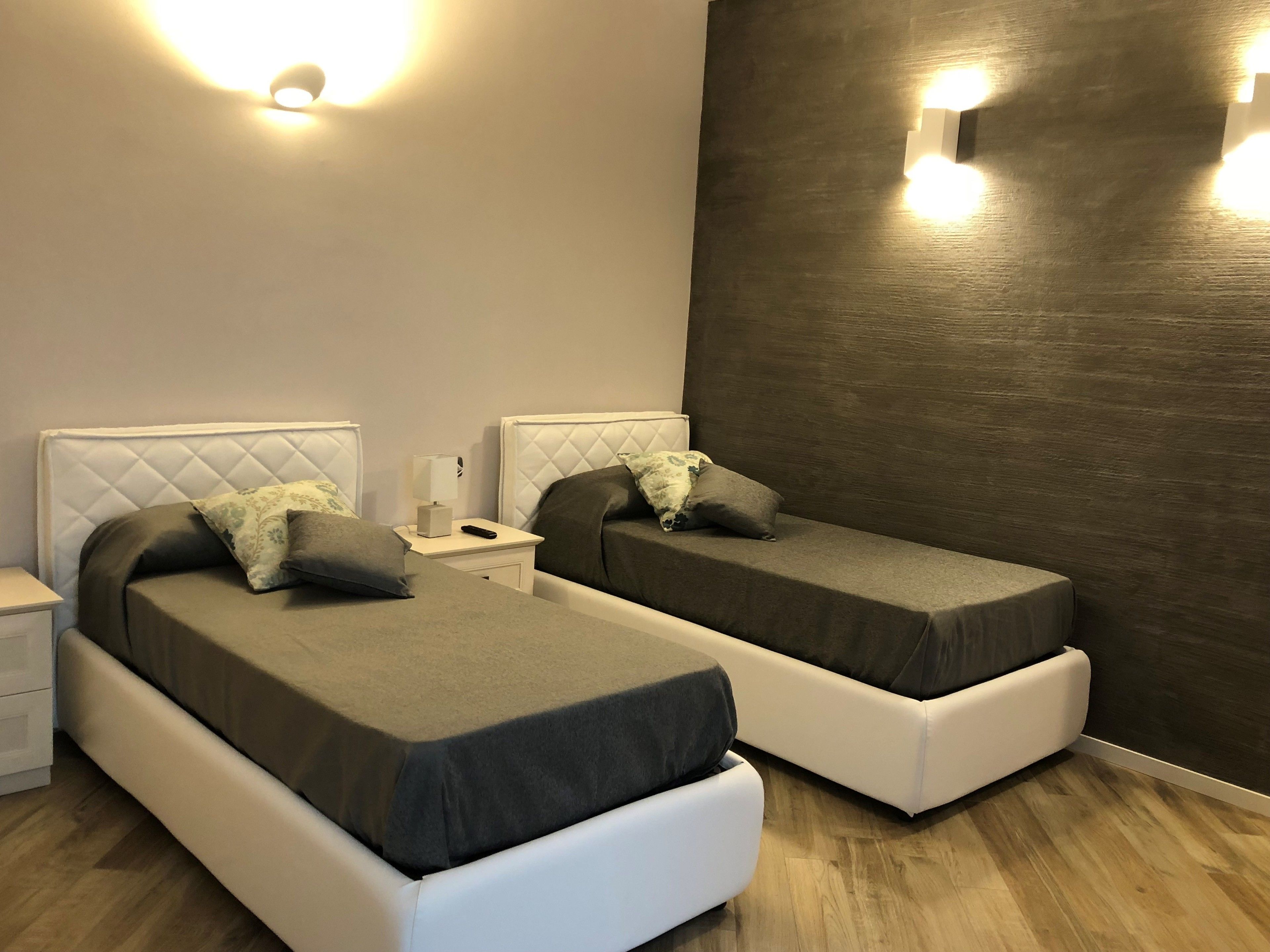 Family Quadruple Room, Courtyard View | Down comforters, in-room safe, desk, blackout drapes