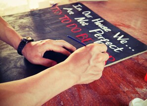 Guests can write their thoughts on a blackboard with a marker.