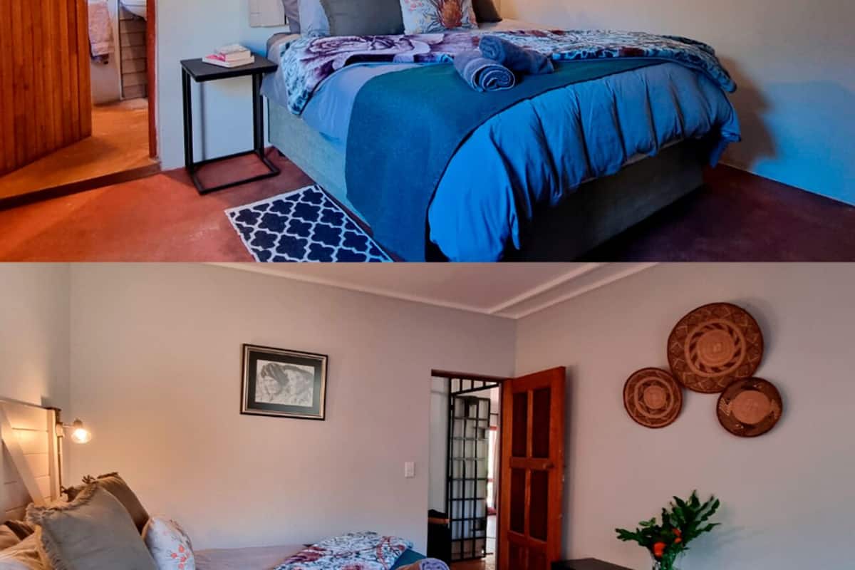 A bedroom with a bed, bedside table, and a door leading to another room.